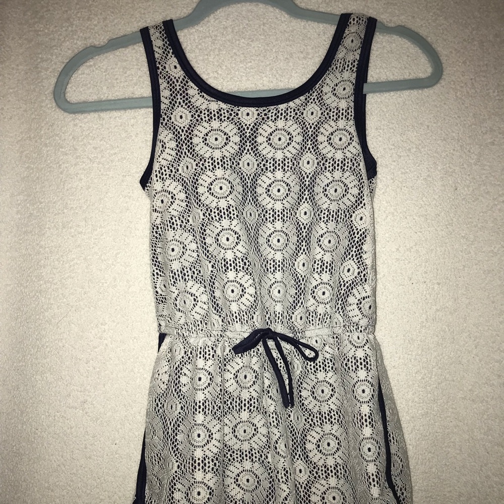 Sporty romper with lace/ mesh detailing on top.